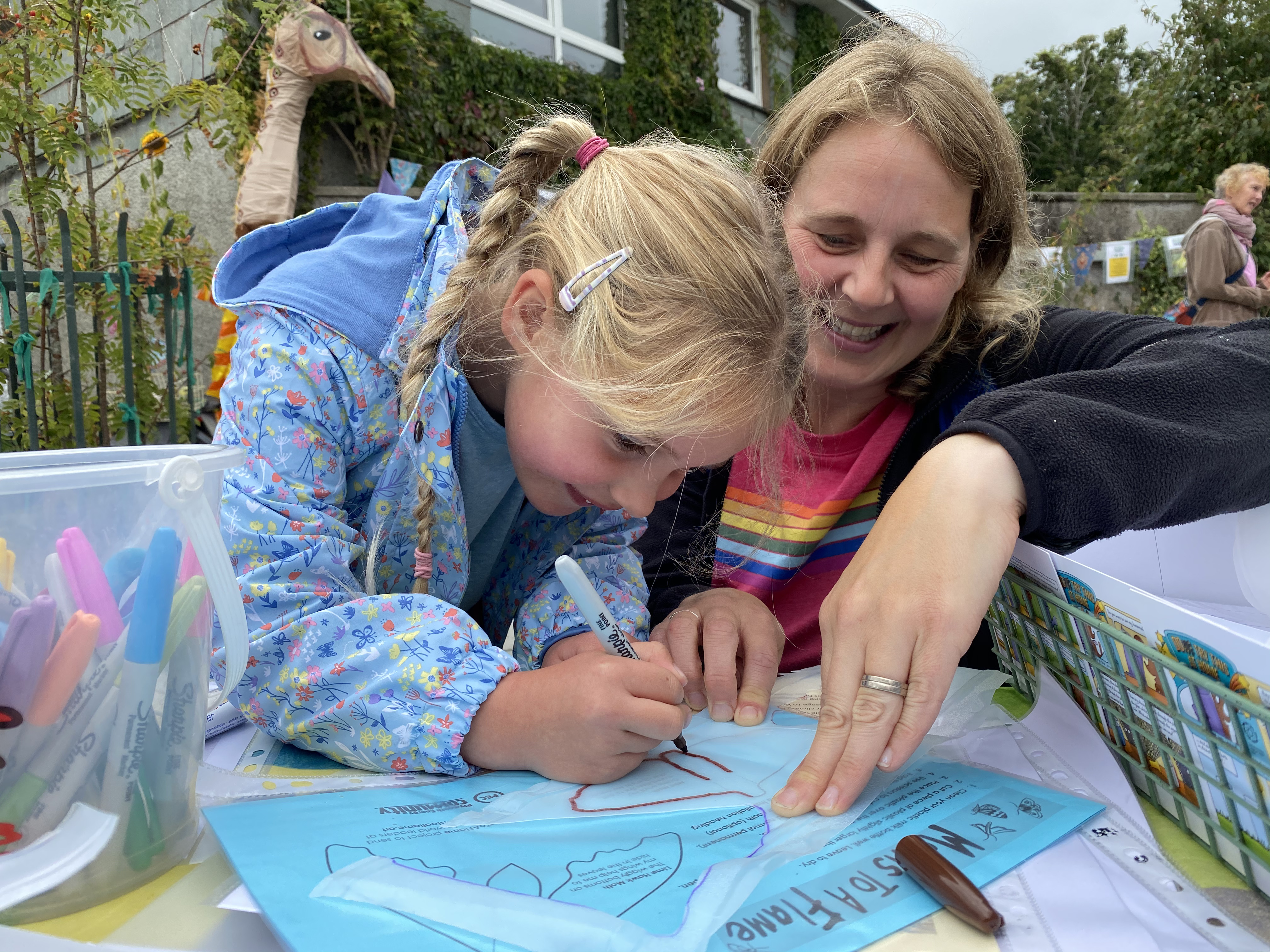 Child and parent taking part in an activity