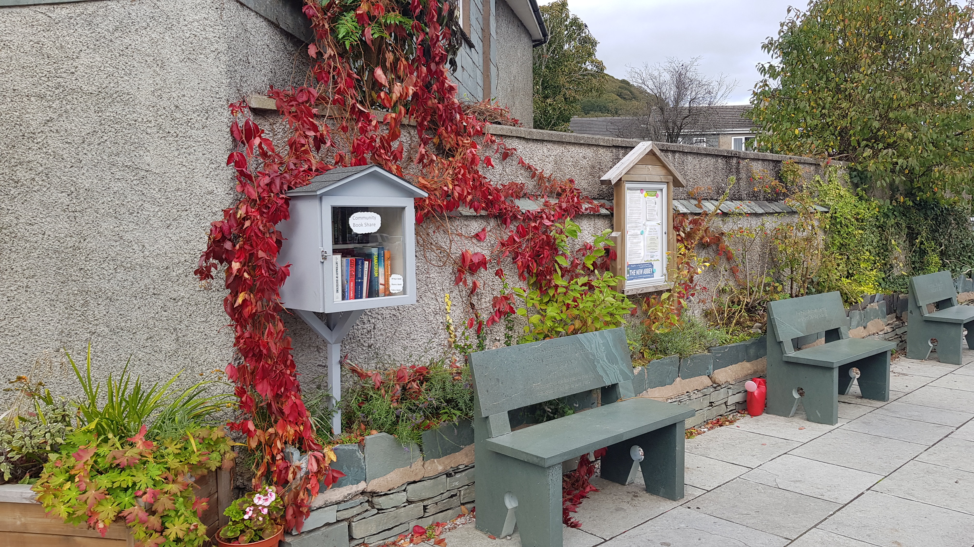 A picture of Jack's Corner in Staveley, a community space in the centre of the village with plants and benches.