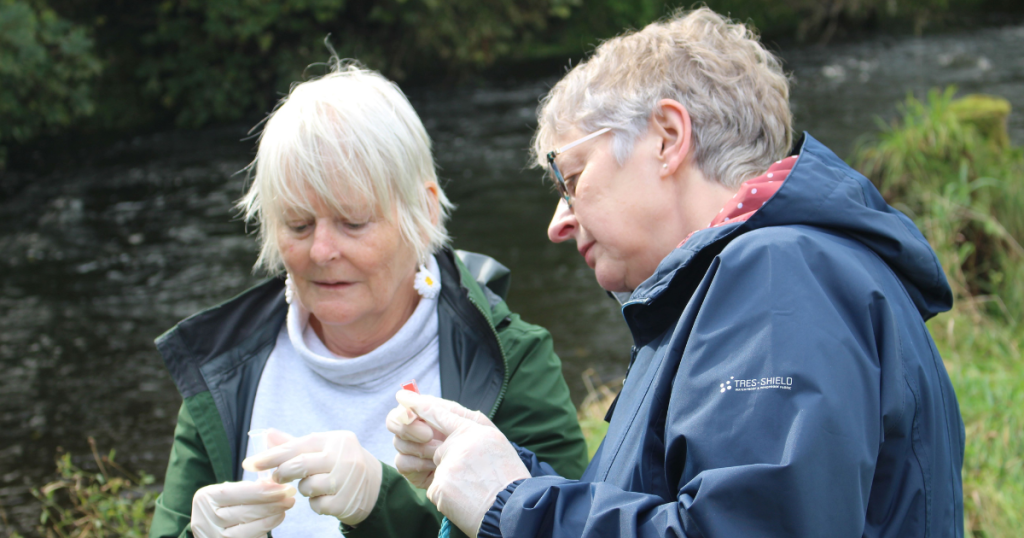 Two members of the Staveley WI helping with river water quality testing